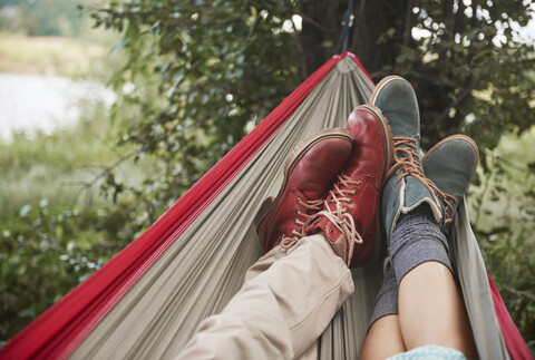 Feet of couple relaxing in hammock, Krakow, Malopolskie, Poland, Europe stock photo