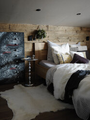 Bedroom interior, wood covered wall behind bed - CUF11153