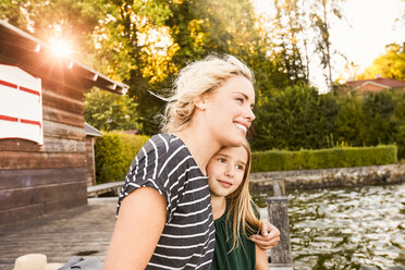 Mother and daughter enjoying themselves by water - CUF11333