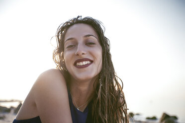 Portrait of happy young woman on beach, Odessa, Ukraine - CUF11478