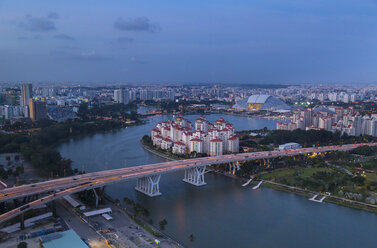 Elevated cityscape with highway bridge and apartment developments at dusk, Singapore, South East Asia - CUF11592