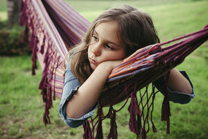Portrait of sad girl lying in hammock - ANHF00053