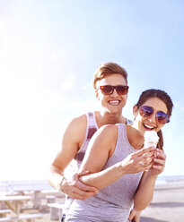 Couple with ice cream smiling - CUF11938