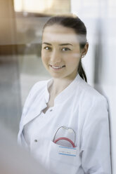 Portrait of female doctor, smiling - CUF12230