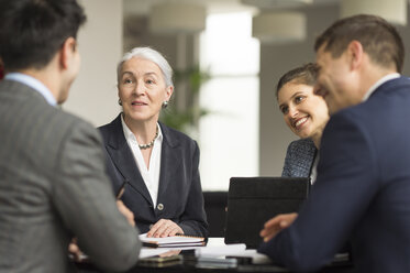 Over shoulder view of business team meeting in office - CUF12304