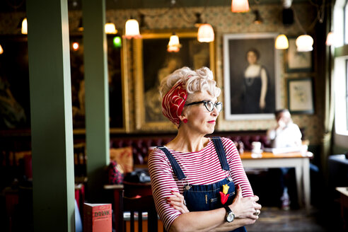 Quirky woman in bar and restaurant, Bournemouth, England - CUF12364