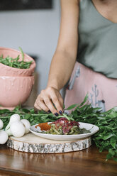 Woman preparing vegetarian dish - CUF12399