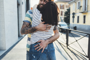 Romantic couple hugging on sidewalk - CUF12459