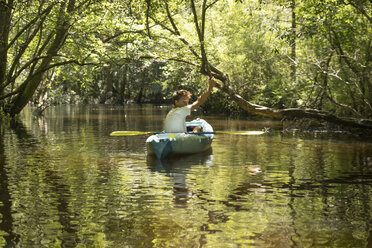 Teenage boy in kayak, Econfina Creek, Youngstown, Florida, USA - ISF02176