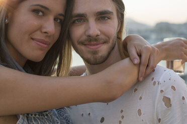 Portrait of young couple on waterfront roof terrace, Budapest, Hungary - ISF02193