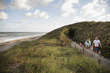 Family walking on coastal path, Blowing Rocks Preserve, Jupiter, Florida, USA - ISF02469