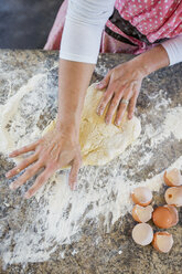 Mature woman making home made pasta, overhead view - ISF02484