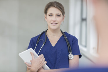 Portrait of female doctor, holding digital tablet - ISF02803