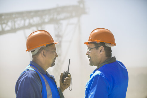 Two quarry workers in discussion, at quarry - ISF02937