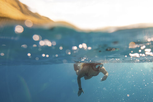 Woman swimming underwater, Oahu, Hawaii, USA - ISF02976