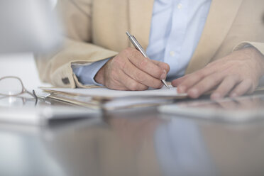 Cropped view of man writing - ISF03132