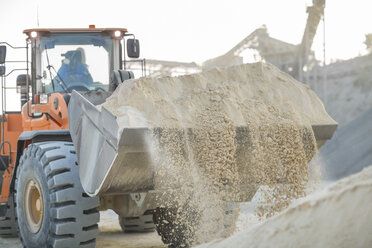 Quarry worker using heavy machinery in quarry - ISF03182