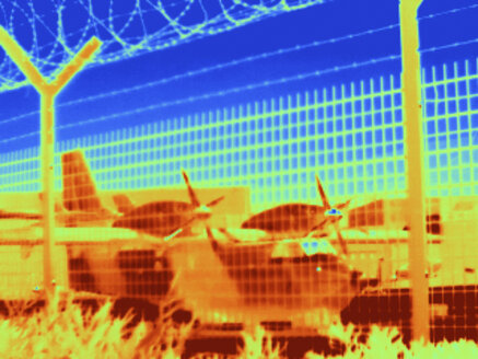 Thermal image of aeroplane seen through wire fence - ISF03448