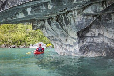 Man kayaking around marble caves, Puerto Tranquilo, Aysen Region, Chile, South America - ISF03469