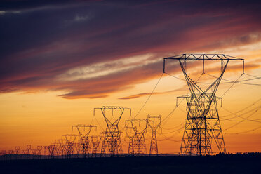 Electricity pylons at sunset, Enterprise, Oregon, United States, North America - ISF03509