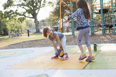 Children playing basketball in playground - ISF03580