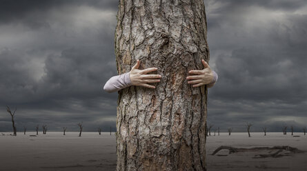 Woman hugging tree, Abbabis, Hardap, Namibia, Africa - ISF04097
