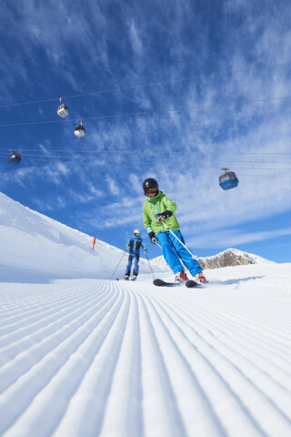 Father and son on skiing holiday, Hintertux, Tirol, Austria stock photo