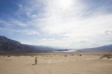 Trekker walking in Death Valley National Park, California, US - ISF04442