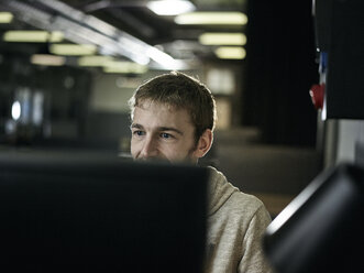 Man working, looking on screen - CVF00609