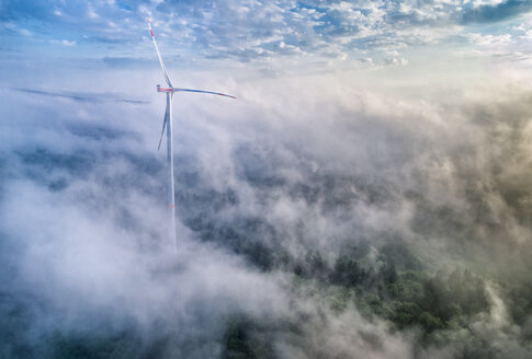 Germany, Baden-Wuerttemberg, Schurwald, Aerial view of wind wheel and morning fog - STSF01561