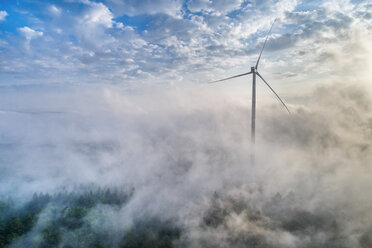 Germany, Baden-Wuerttemberg, Schurwald, Aerial view of wind wheel and morning fog - STSF01562