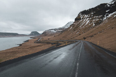 Iceland, empty wet coastal road - KKAF01017