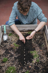 Man planting seeds in soil - ISF04557