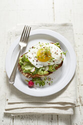 Avocado toast with radish, fried egg and micro greens - ISF04806