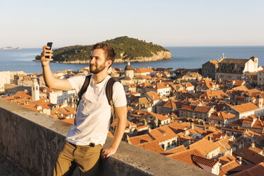 Man taking selfie, Dubrovnik, Dubrovacko-Neretvanska, Croatia, Europe - ISF05516