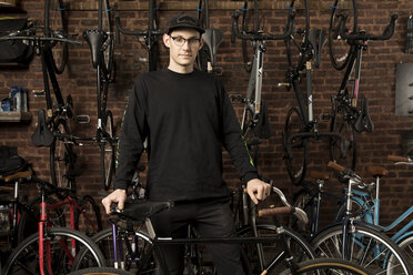 Man in bicycle shop - ISF05576