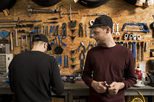 Technicians in bicycle workshop - ISF05584