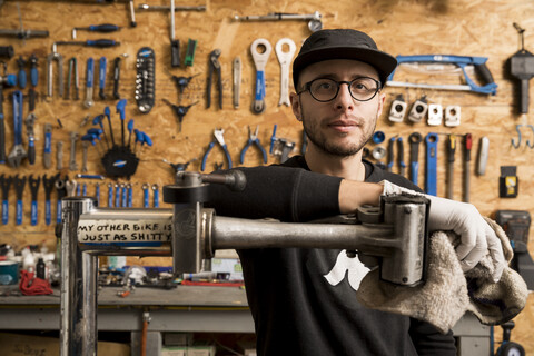 Technician in bicycle workshop stock photo