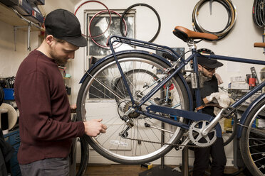 Technicians in bicycle workshop - ISF05587