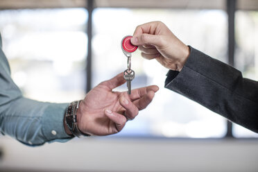 Estate agent handing keys to homebuyer, close-up - ISF05742