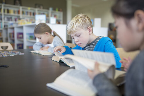 Students engrossed in reading during their break in the school's cozy and inviting break room - WESTF24141