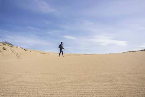 Man walking on sand, Arbus, Sardinia, Italy, Europe - ISF05895