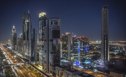 Cityscape and skyscraper skyline at night, Dubai, United Arab Emirates - ISF05897