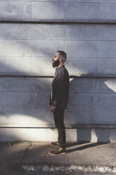 Full length side view portrait of bearded man - ISF05922