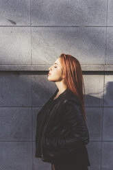 Side view portrait of red haired woman, eyes closed - ISF05931