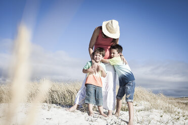 Mother and sons on beach, Cape Town, South Africa - ISF06090