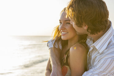 Romantic young couple on sunlit beach, Majorca, Spain - CUF13198