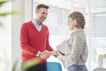 Man shaking hands at job interview - ISF06138