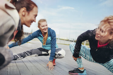 Four women having an outdoor workout stock photo