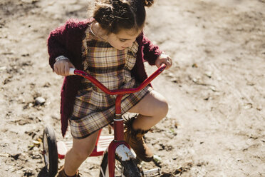 Girl on tricycle - ISF06331